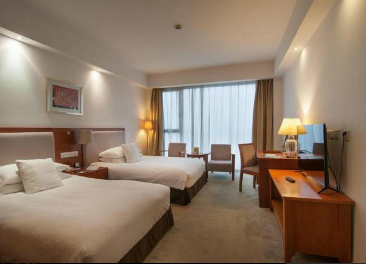 Gloria Plaza Hotel Kangqiao Шанхай Экстерьер фото